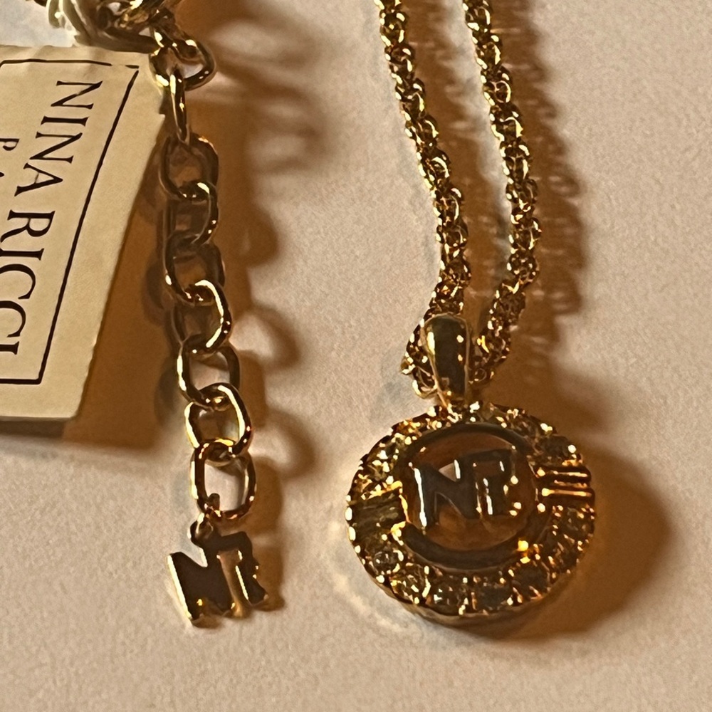 Nina Ricci Gold Chain Necklace with Monogram Pendant